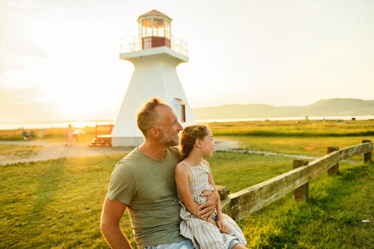 tourist father and daughter enjoying time in Gaspesie phar