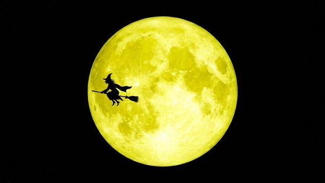 Silhouette of witch on broomstick against large full moon