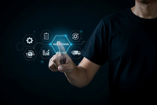 Businessman pointing at glowing blue digital value chain icons overlay against dark background