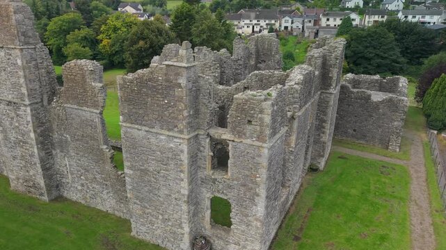 Close drone orbit around the ruined tower and roofless interior of Castle Caulfield, County Tyrone, Northern Ireland