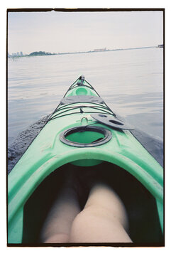 Kayaking on a calm lake during a cloudy day