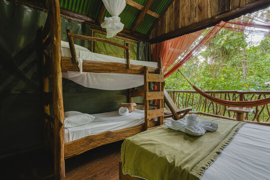 Rustic ecolodge treehouse room offering tropical rainforest escape