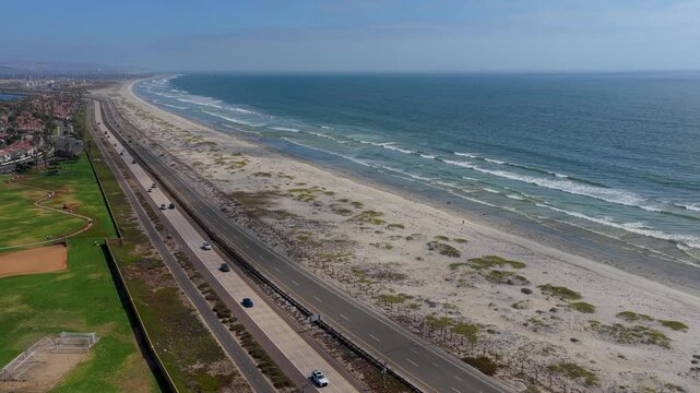 Aerial Coronado Cays Park San Diego Coastline Beach and Road Flyover