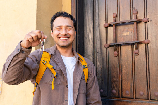 smiling homeowner house keys