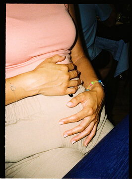 Woman experiencing abdominal discomfort after eating meal