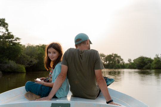 Father and Daughter Enjoying River Sunset. Travel, Sri Lanka