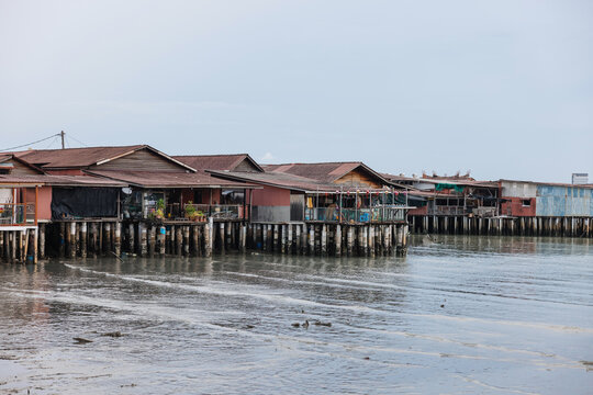 Traditional stilt houses along a coastal waterfront
