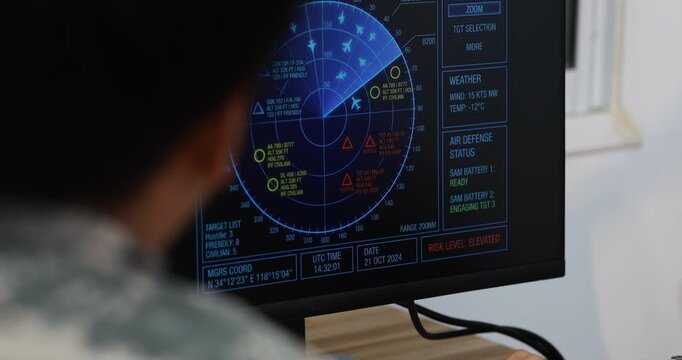 Military operator uses a touchscreen radar display aircraft tracks, warning symbols, and control data in a command room.