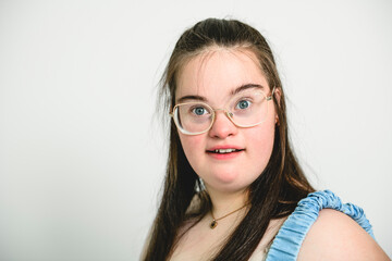 Fototapeta premium kid girl with Down syndrome over white background