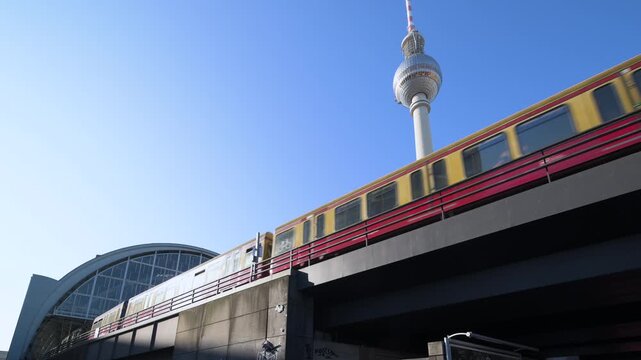 Berlin Alexanderplatz television tower with S Bahn train passung 4K