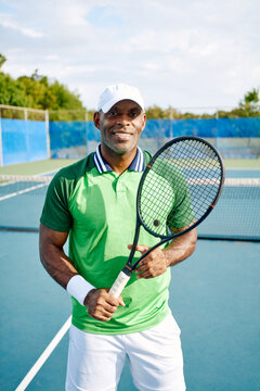 Portrait of a confident tennis coach