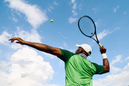Tennis player serving the ball