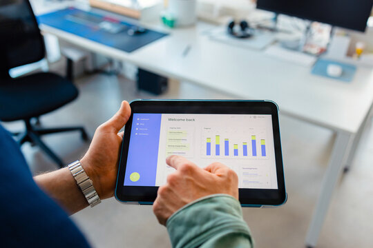 Tablet Showing Analytics Dashboard in Office