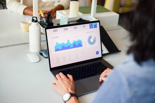 Business Analytics Dashboard on Laptop in Office