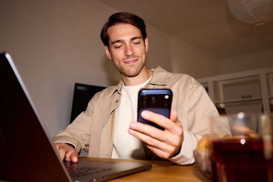 Man performs multitasking at home