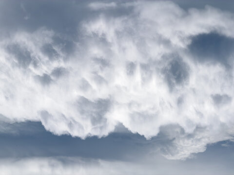 Dense, billowing clouds dominate the sky