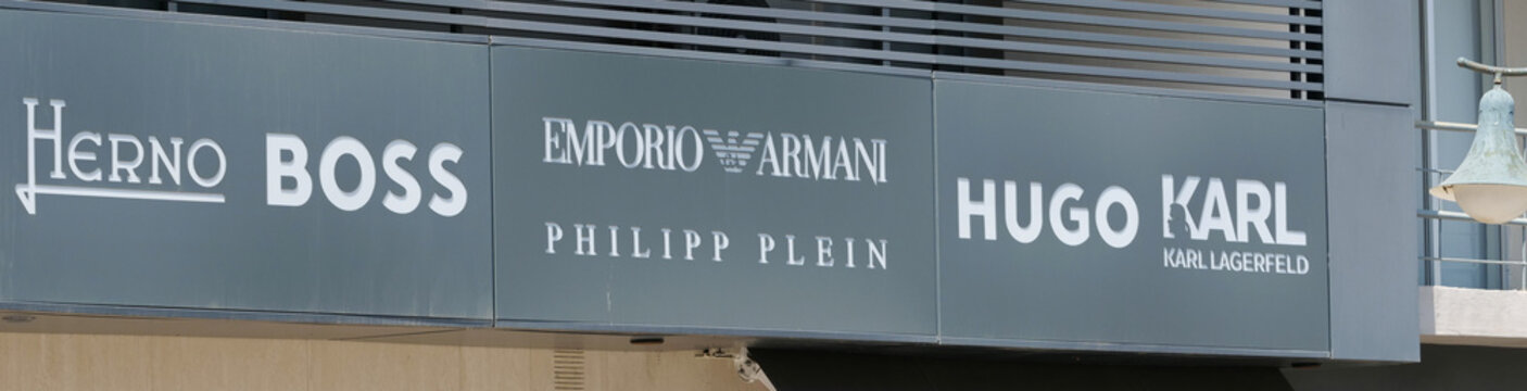 Greek, Rhodes, August 17. 2026, Luxury designer fashion brands signage Herno, Boss, Emporio Armani, Philipp Plein, Hugo, and Karl Lagerfeld