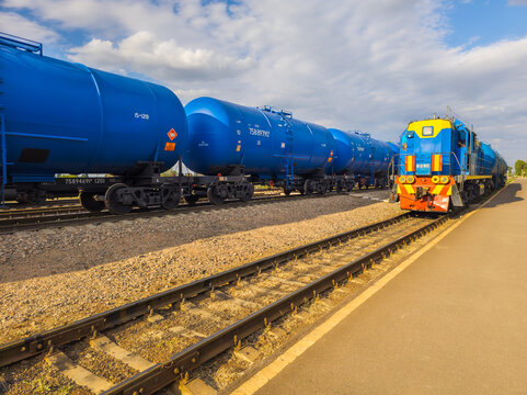 Blue Freight Train with Tank Cars on Tracks in Kyrgyzstan