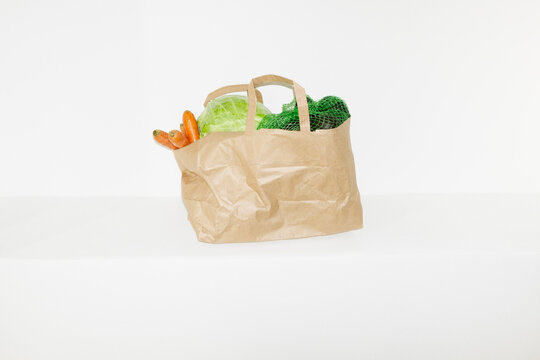 Food grocery store delivery in a brown paper bag in the hallway
