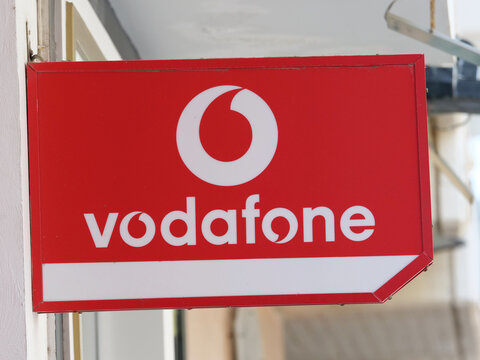  Greece, Rhodes, August 17. 2026, Vodafone Tech Service and CU mobile network brand logo signs