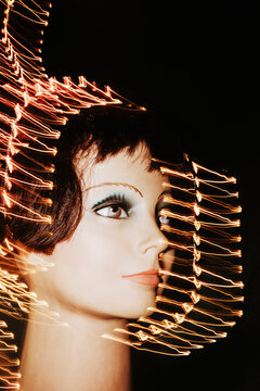 Mannequin Head With Light Trails in Dark Setting