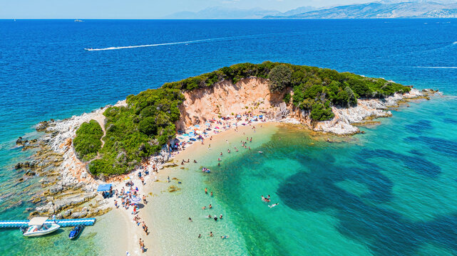 Aerial drone view of the sandy cove and turquoise waters on the twin islands (Ishujt Binjak&euml;) in Ksamil, Albania
