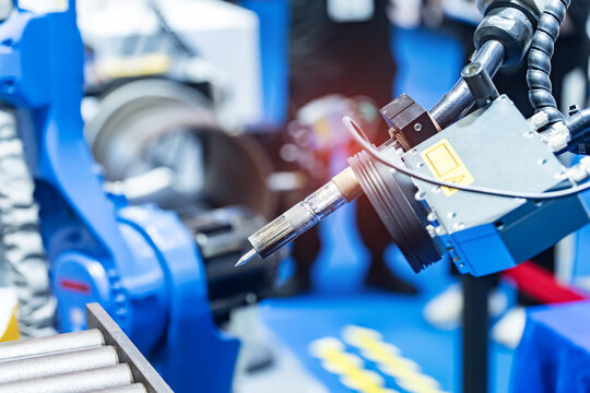 Industrial robotic welders weld the car body on factory. Machine robot arm. Smart industry. Automobile production