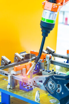Industrial robotic welders weld the car body on factory. Machine robot arm. Smart industry. Automobile production