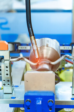 Industrial robotic welders weld the car body on factory. Machine robot arm. Smart industry. Automobile production