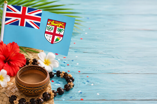Fijian culture and kava ceremony concept for Fiji Day, with flag, tropical flowers and copy space.