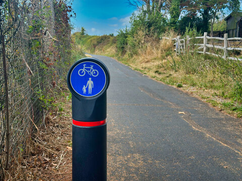 Blue Shared-Use Cycle and Pedestrian Route Post Sign on a Country Path