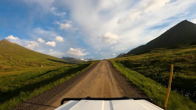 POV of an off-road vehicle driving on a scenic gravel road in the north of Iceland
