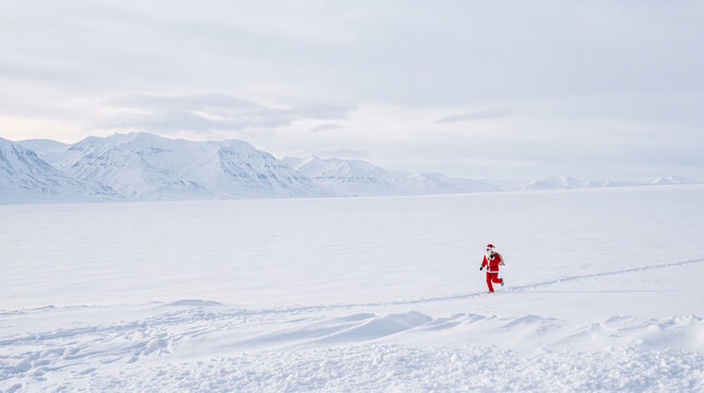 Santa Run Runner Across Vast Snowy Landscape