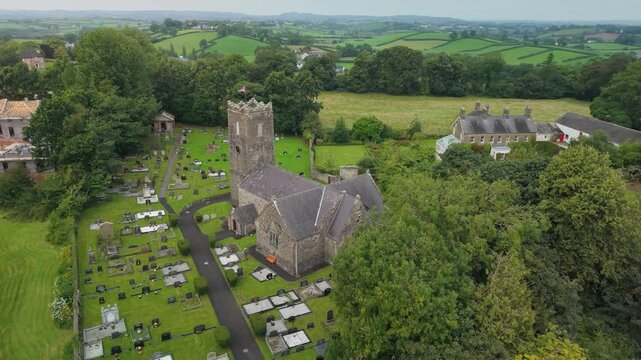 Aerial view of the battlemented tower and churchyard of St Michael's Church of Ireland, Castlecaulfield, County Tyrone, Northern Ireland