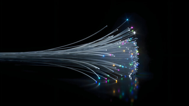 Fiber optics glowing with rainbow colors during a digital data transmission concept against a reflective surface