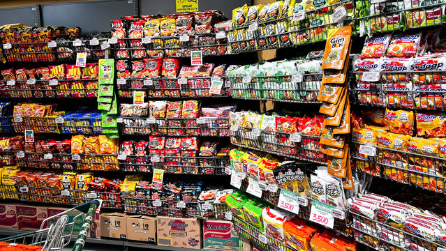 Various instant noodles are displayed on the shelves of a supermarket. Bekasi, Indonesia, August 27, 2026