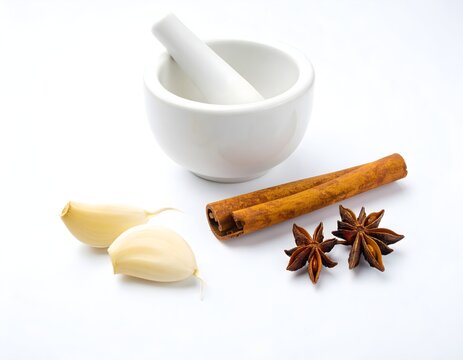 Cinnamon spice with garlic on white background