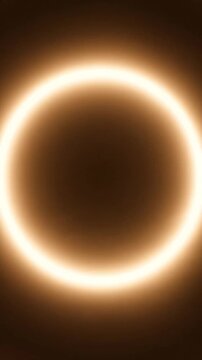 Glowing Light Ring Animation Expanding and Contracting in a Dark Space. Seamless Looping Footage for Abstract Backgrounds.