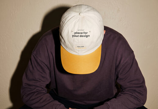 Person Wearing Baseball Cap from Top Branding Mockup