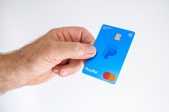 Hand holding PayPal Business Debit Mastercard