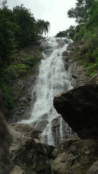 Beautiful waterfall flowing through lush nature. Freshwater sustains life and ecosystems while highlighting water conservation biodiversity and environmental protection for a sustainable future.
