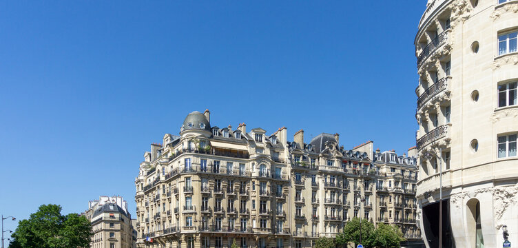 Paris Haussmann buildings architecture under clear blue sky