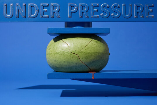 Cracked Watermelon Under Pressure Concept with Blue Studio Still Life