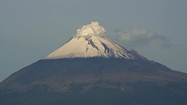 Popocatepetl volcano erupting smoke at dawn in puebla mexico