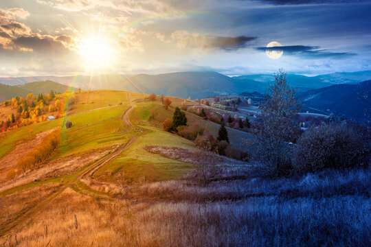 winding rural dirt path through hill. rolling countryside of ukraine on autumn equinox. cloudy sky at twilight. carpathian mountains in fall searon