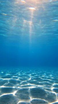 Underwater Sunlight Beams Shifting Through Clear Ocean Water, Creating a Dynamic, Rippling Effect. Tranquil Blue Water Surface Animation.