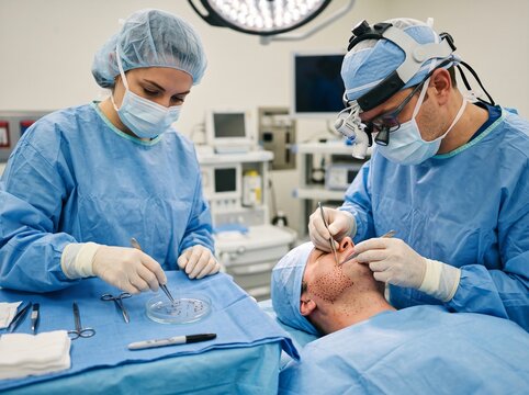 Surgeons Performing Specialized Facial Procedure in Hospital Operating Room
