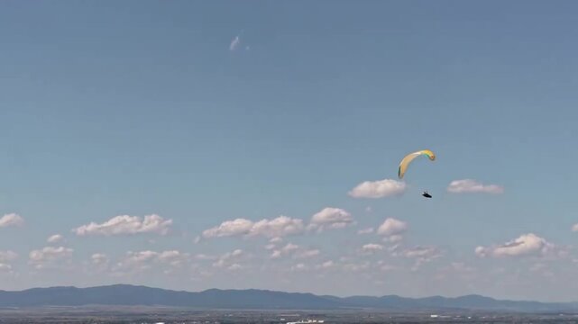 paragliding in the blue sky