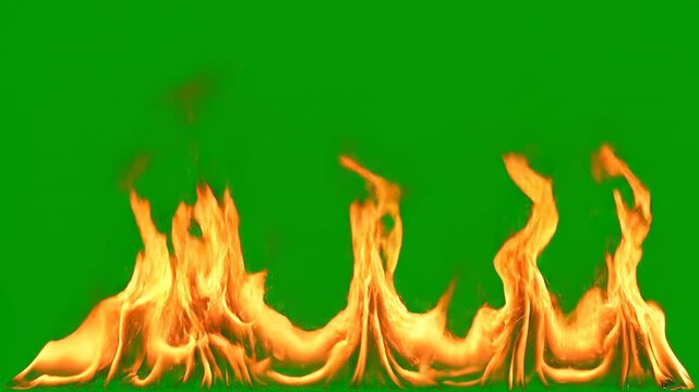 Energetic fire flames burning with movement on a green screen background during a cinematic shot