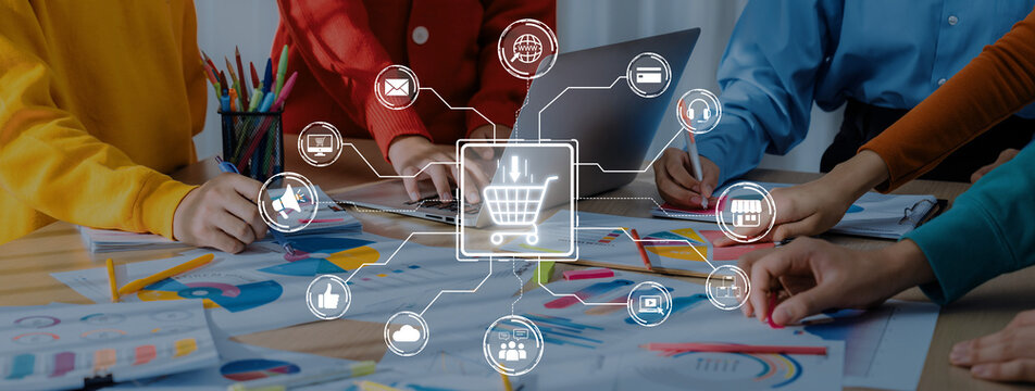 A vibrant teamwork scene focusing on digital marketing strategy development, showcasing diverse professionals collaborating over colorful charts and advanced technology tools. Trope